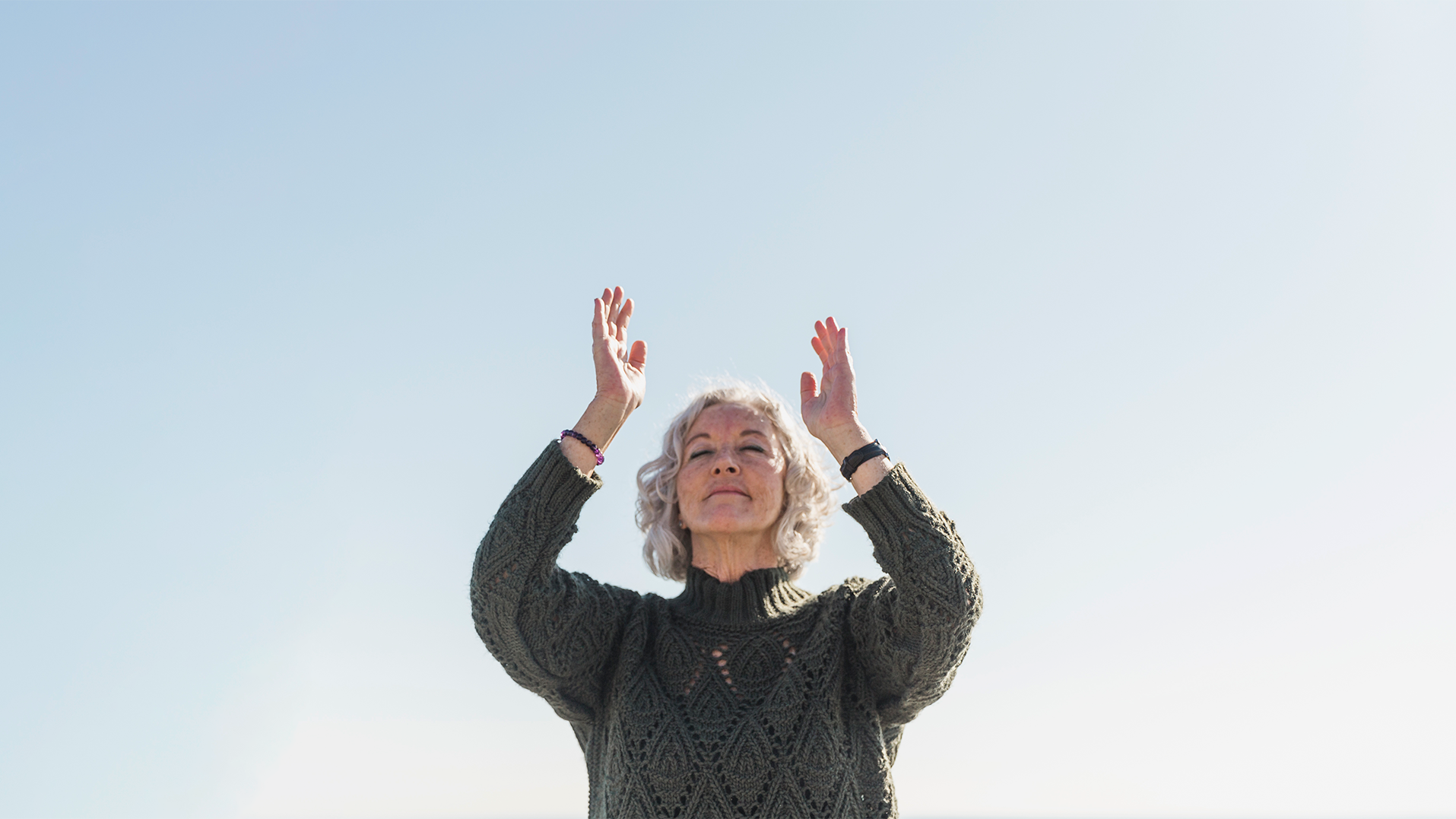 low-angle-woman-meditating-outdoors centered